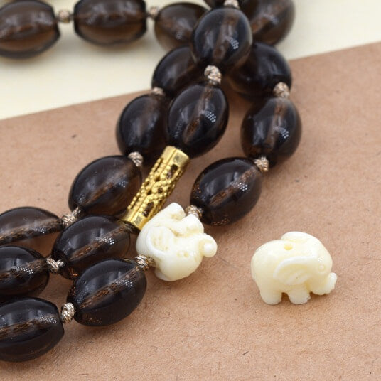 Ivory white elephant resin bead 10x6mm - Hole: 1mm (1)